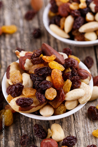 Mixed nuts on a white plate.