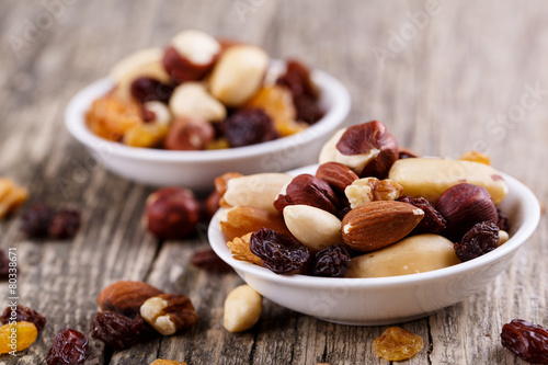 Mixed nuts on a white plate.