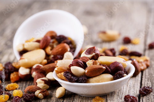 Mixed nuts on a white plate.