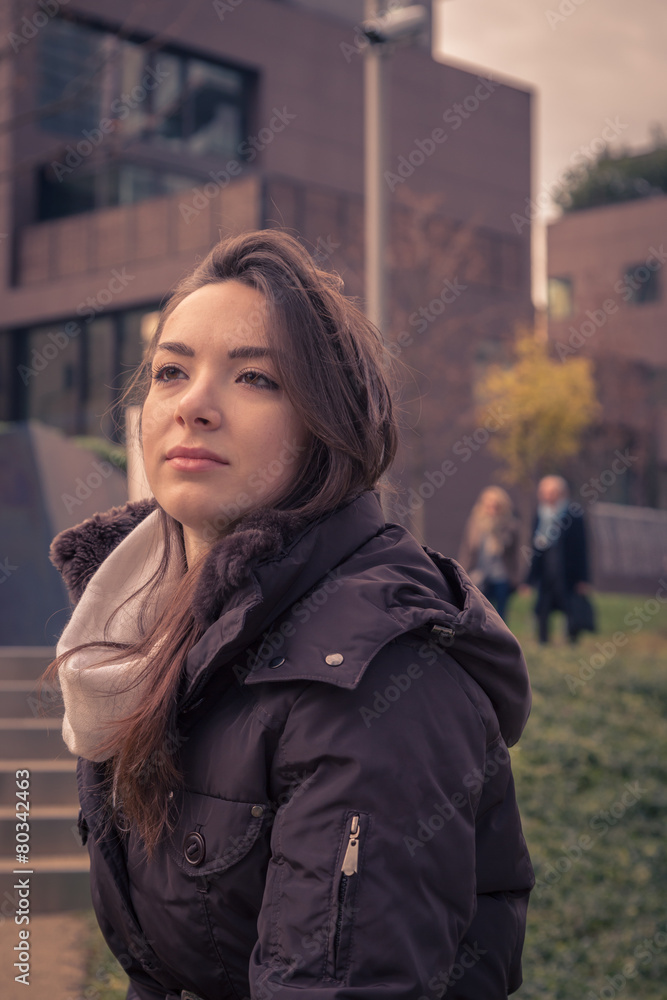 Young beautiful girl posing in the city streets Young beautiful girl posing in the city streets