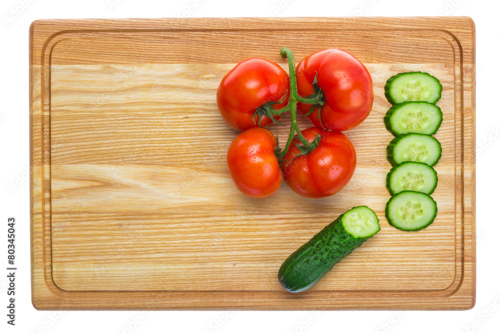 fresh tomatoes and sliced cucumber on a wooden cutting board fresh tomatoes and sliced cucumber on a wooden cutting board