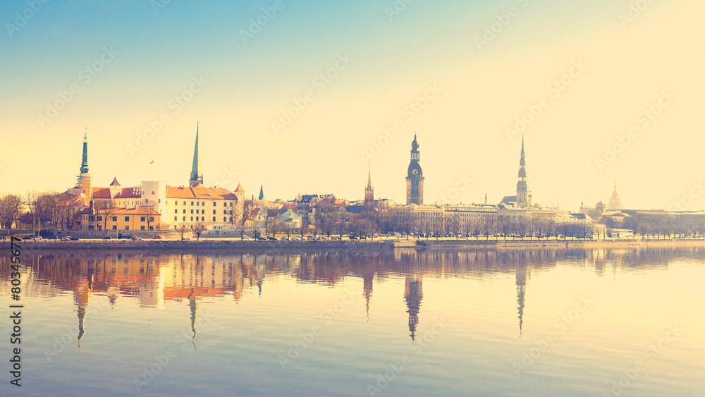 Riga center with reflection in Daugava, with retro filter effect