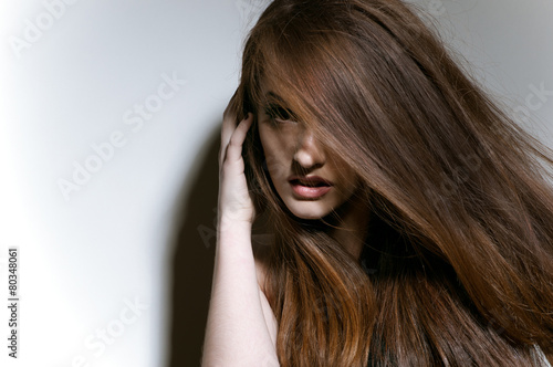 Studio portrait of girl with long fair hair