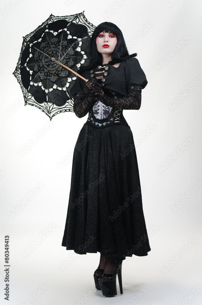 Gothic vampire in black dress with umbrella Stock Photo | Adobe Stock