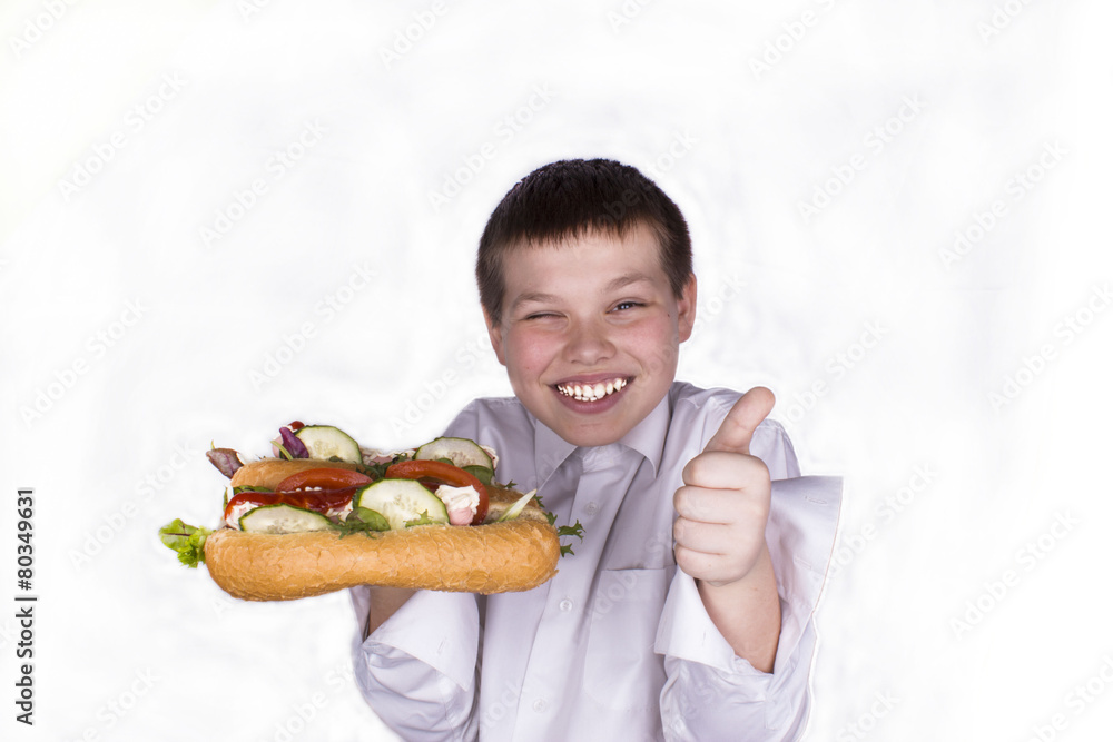 a boy of twelve years holding two hot hot dog a boy of twelve years holding two hot hot dog