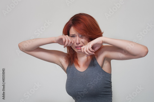 Portrait of young crying girl photo