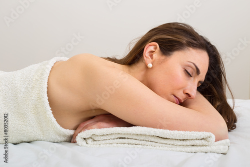 young woman relaxing at the spa