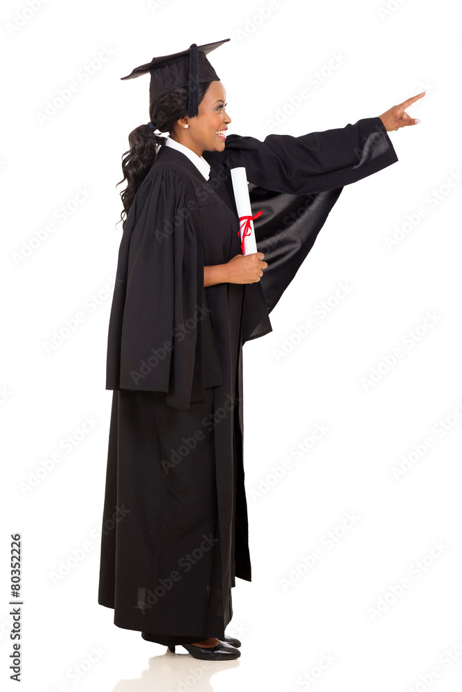 female african graduate pointing empty space female african graduate pointing empty space