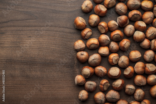 hazelnuts on the brown wooden table