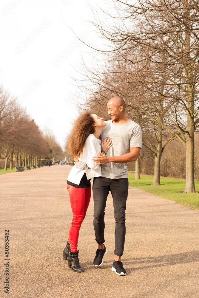 Fototapeta premium young couple walking in the park