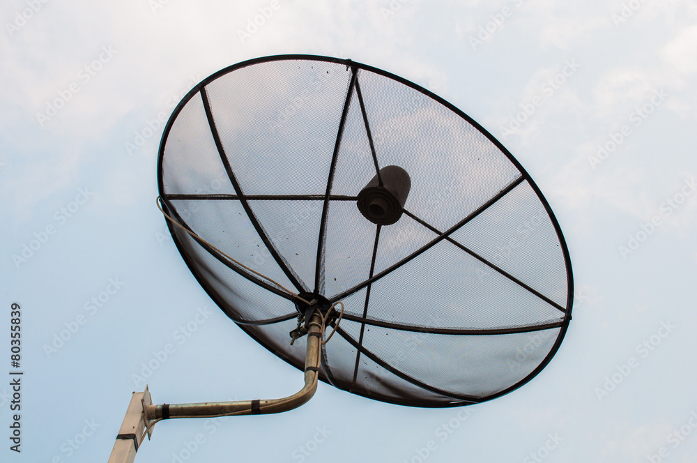 Satellite dish with sky background.