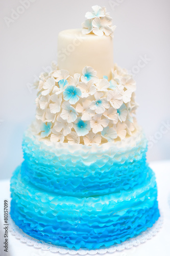 Delicious blue and white wedding cake