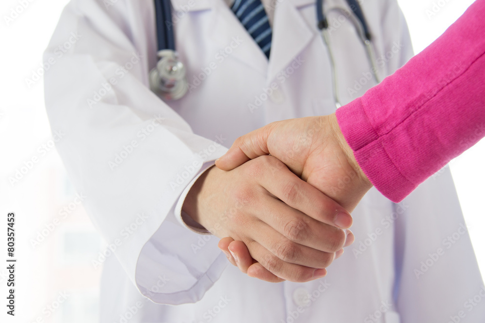 Doctor and patient shaking hands Doctor and patient shaking hands