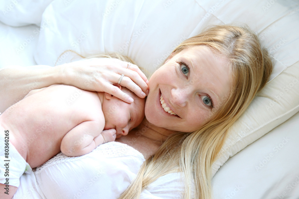 Fototapeta premium Happy Mother and Baby Resting in Bed