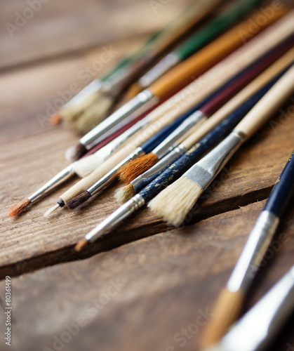 Paintbrushes on a wood background,