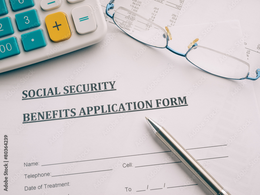 social security benefits application form on the desk. social security benefits application form on the desk.