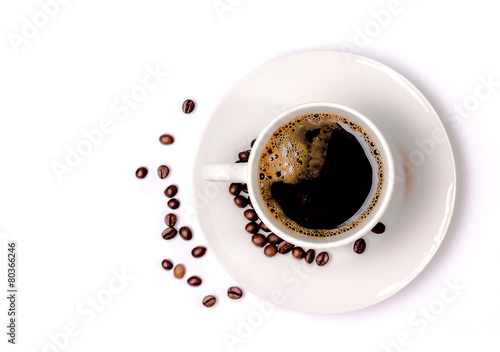 isolated coffee cup and saucer and coffee beans. Top view