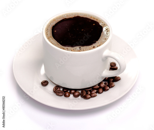 isolated coffee cup and saucer and coffee beans.