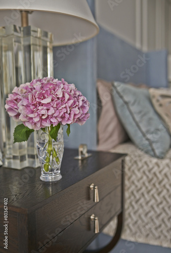 pillows with flower in bedroom interior