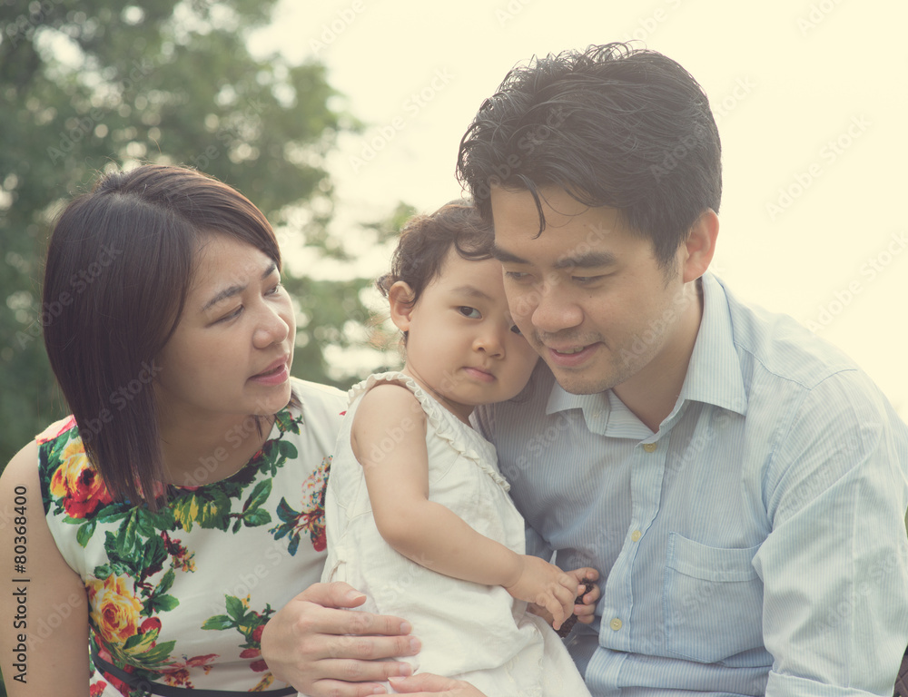 asian family playing and enjoying quality time outdoor asian family playing and enjoying quality time outdoor
