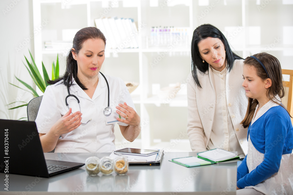 .Young woman and her daughter at the doctor homeopaths .Young woman and her daughter at the doctor homeopaths