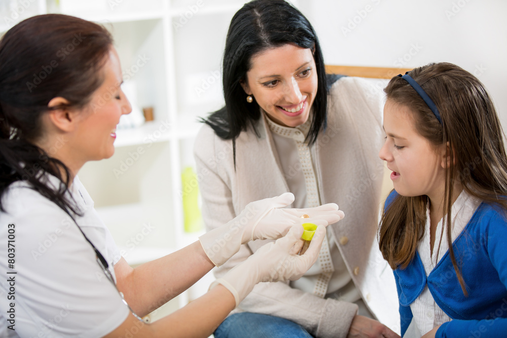 Doctor gives homeopathic pills child Doctor gives homeopathic pills child
