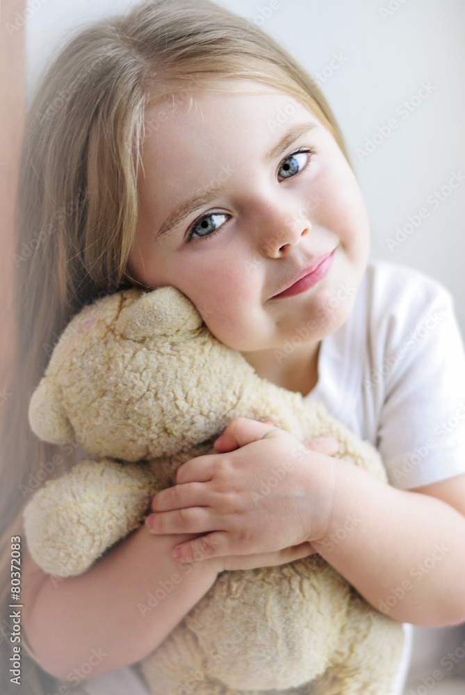 beautiful little girl with a favorite toy beautiful little girl with a favorite toy