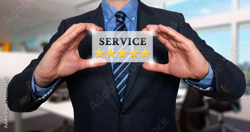 Businessman holding white card with Service Five Stars sign