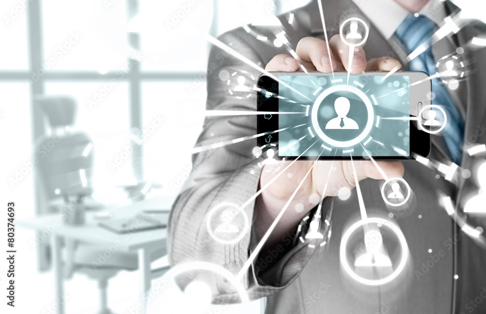 Fototapeta premium Business Hand holding a phone show the social network