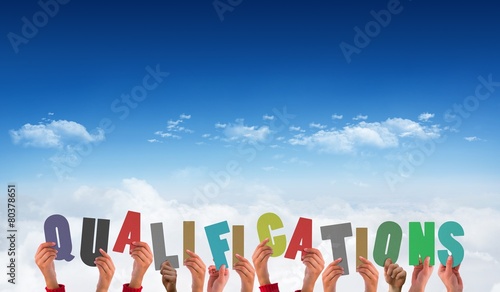 Composite image of hands holding up qualifications