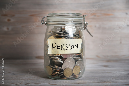 Money jar with pension label.