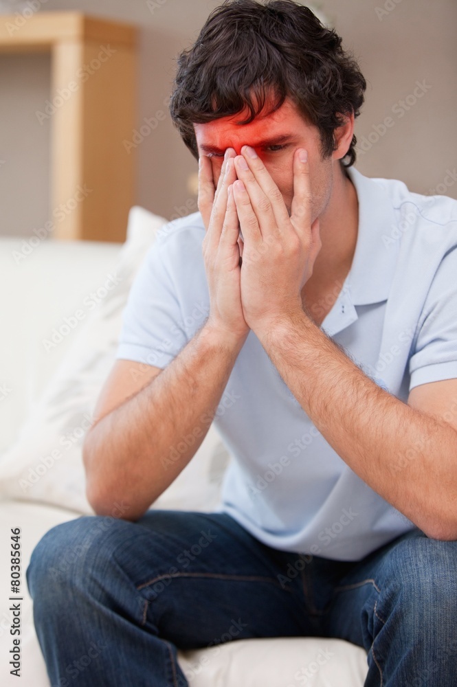 Desperate man sitting on the sofa Desperate man sitting on the sofa