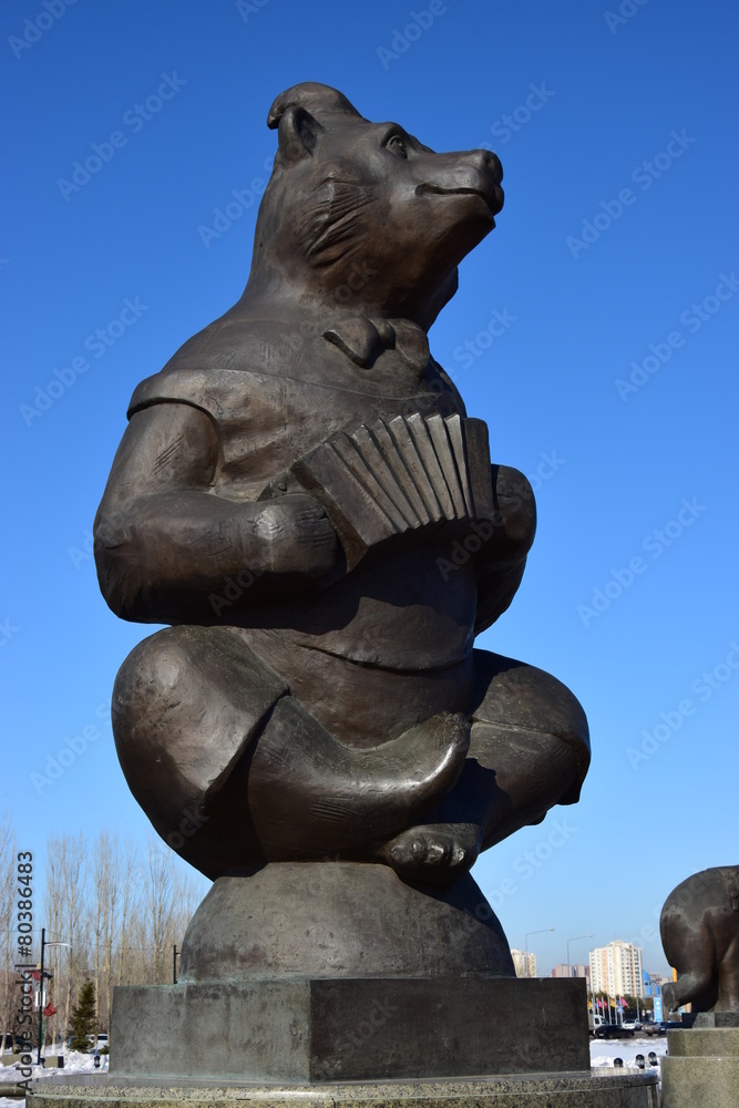 Statue featuring a circus bear with an accordeon, in Astana