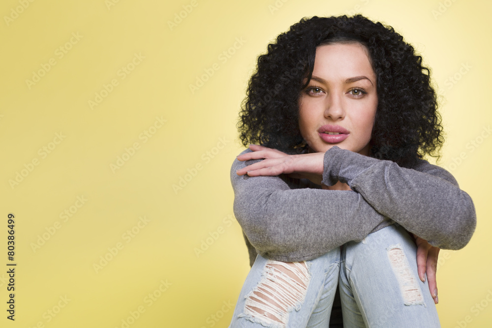 Young woman looking sensual on yellow background. Young woman looking sensual on yellow background.