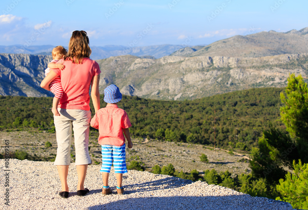 mother with kids travel in mountains vacation