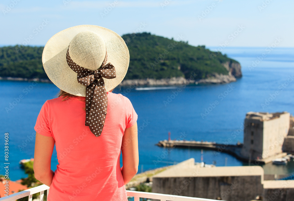 young woman enjoying view of Dubrovnik