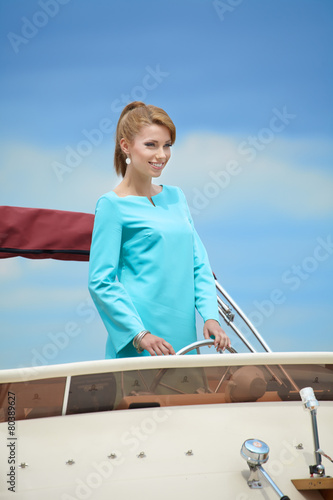 Beautiful woman near the boats and yachts. Outdoors, lifestyle © ZoomTeam