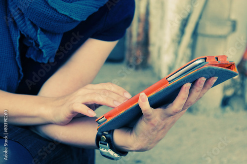 close up woman's hands with tablet