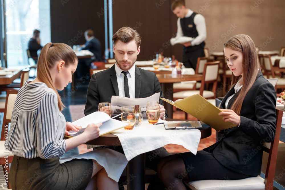 Business deals during lunch at the buffet restaurant Business deals during lunch at the buffet restaurant
