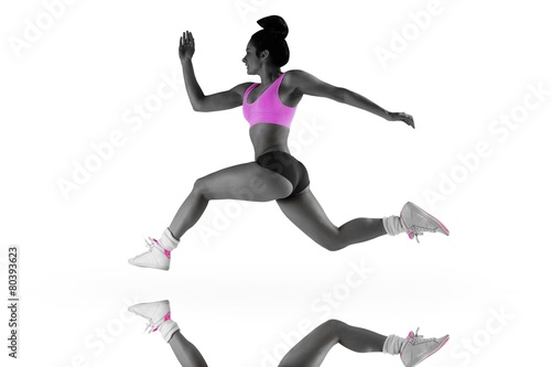 Fototapeta Naklejka Na Ścianę i Meble -  Composite image of fit brunette running and jumping