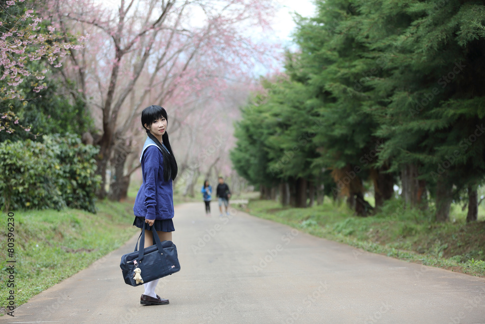 Fototapeta premium asian schoolgirl with nature