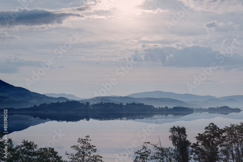 Hazy Sunrise in mountain lake