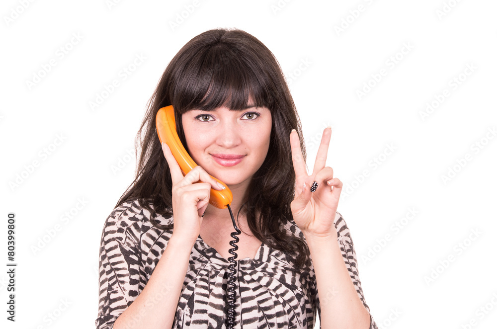 beautiful young woman using retro orange telephone beautiful young woman using retro orange telephone