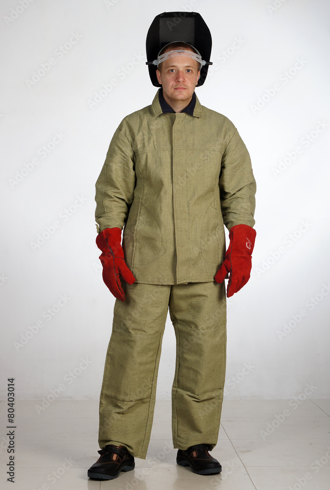 Man posing in overalls.isolated studio portrait Man posing in overalls.isolated studio portrait