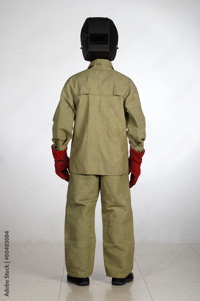 Man posing in overalls.isolated studio portrait Man posing in overalls.isolated studio portrait