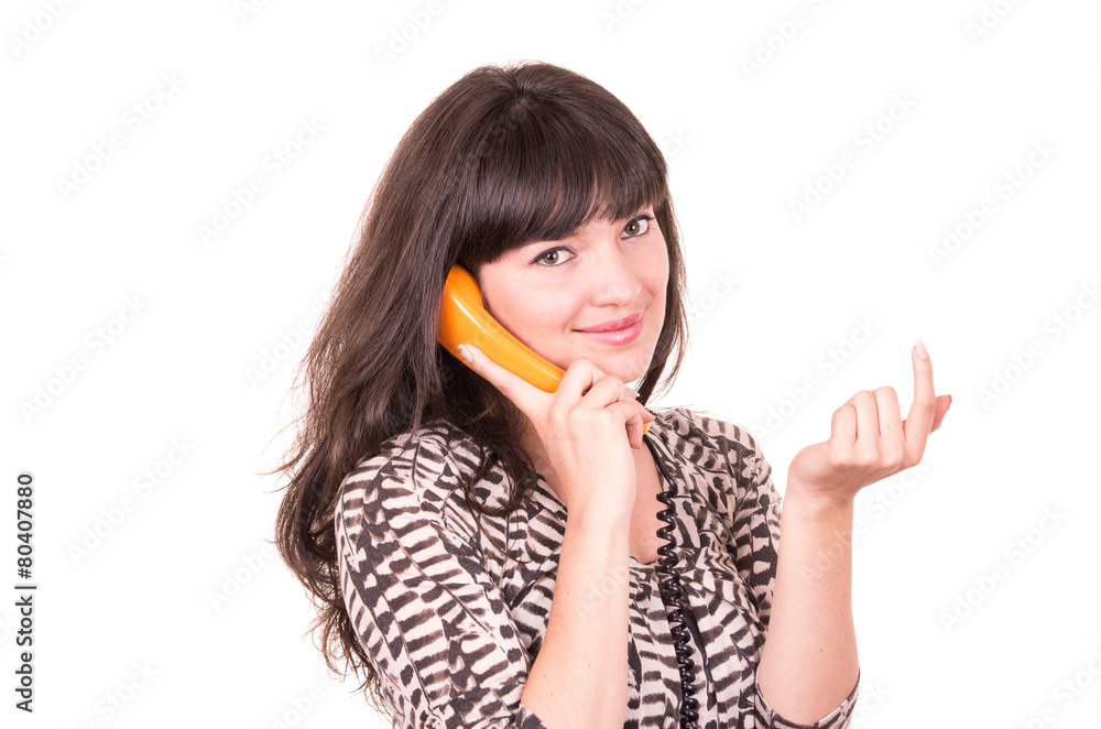 beautiful young woman using retro orange telephone beautiful young woman using retro orange telephone