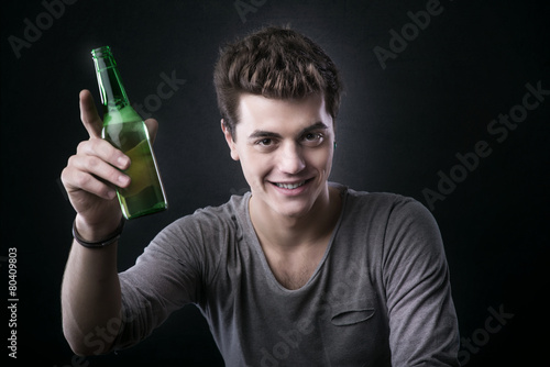 Handsome guy having a beer