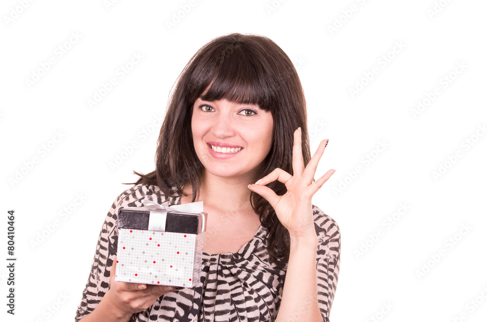 beautiful young happy girl holding present wrapped in a box beautiful young happy girl holding present wrapped in a box