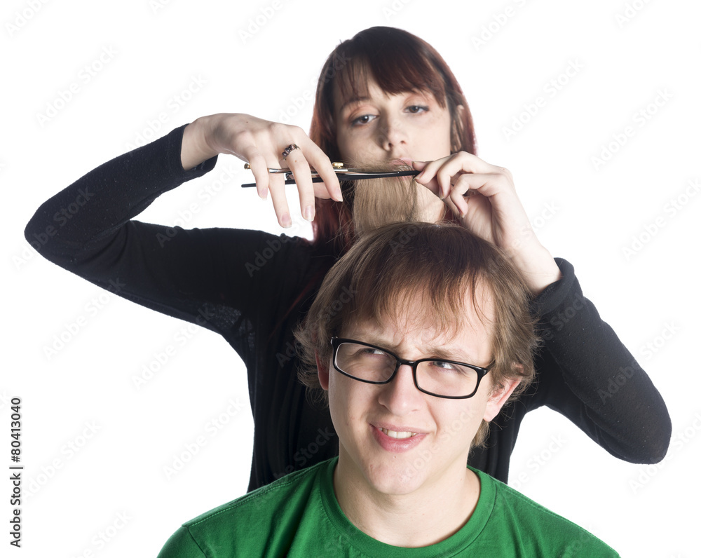 Female hair stylist cutting hair of a worried man Female hair stylist cutting hair of a worried man