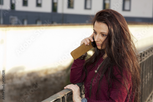 attractive young woman with mobile phone photo